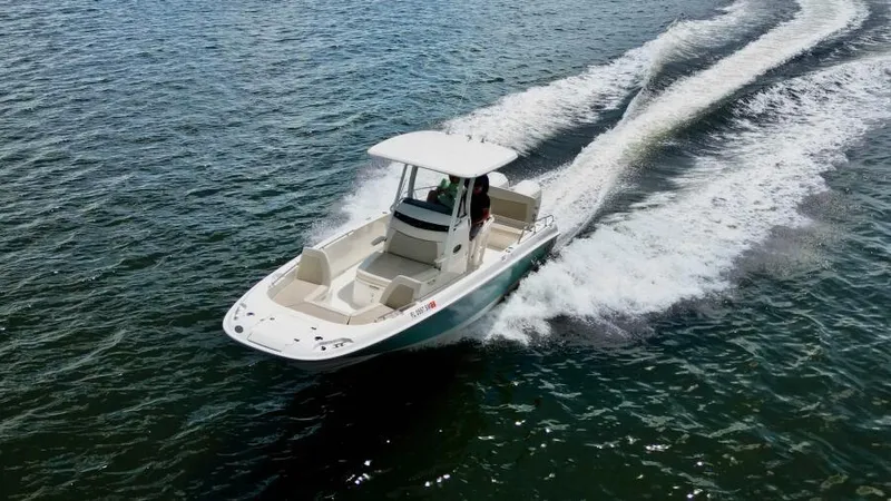  Yacht Photos Pics 2019 Boston Whaler DAUNTLESS boat cruising on open water.