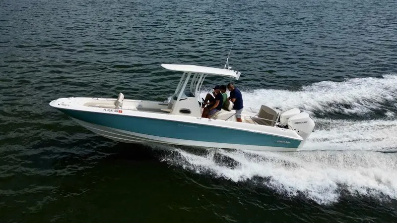  Yacht Photos Pics 2019 Boston Whaler DAUNTLESS boat cruising on open water.