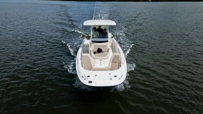  Yacht Photos Pics 2019 Boston Whaler DAUNTLESS boat cruising on open water.