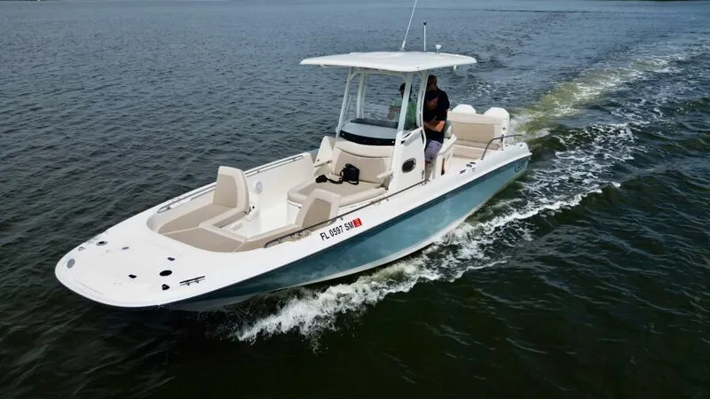 Yacht Photos Pics 2019 Boston Whaler DAUNTLESS boat cruising on open water.