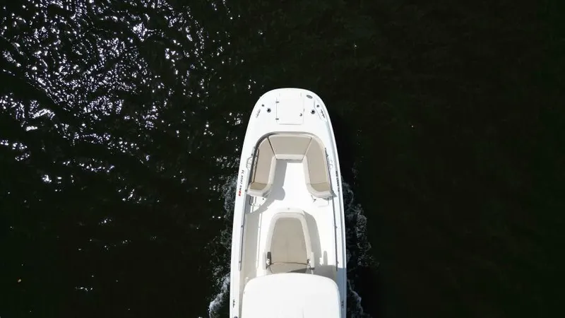  Yacht Photos Pics Aerial view of 2019 Boston Whaler DAUNTLESS boat on dark water.
