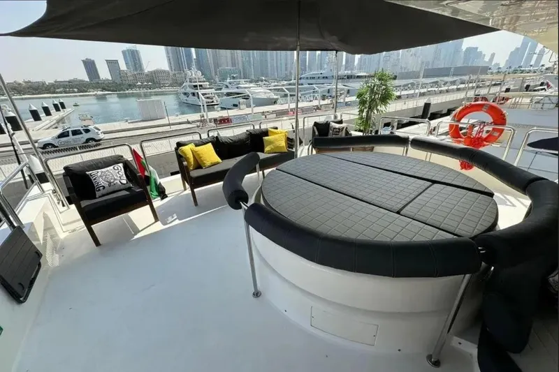  Yacht Photos Pics Luxurious deck of 2003 Azimut 98 Leonardo yacht with seating, overlooking marina.