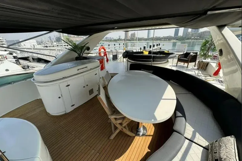  Yacht Photos Pics Luxurious 2003 Azimut 98 Leonardo yacht deck with elegant seating and dining area.