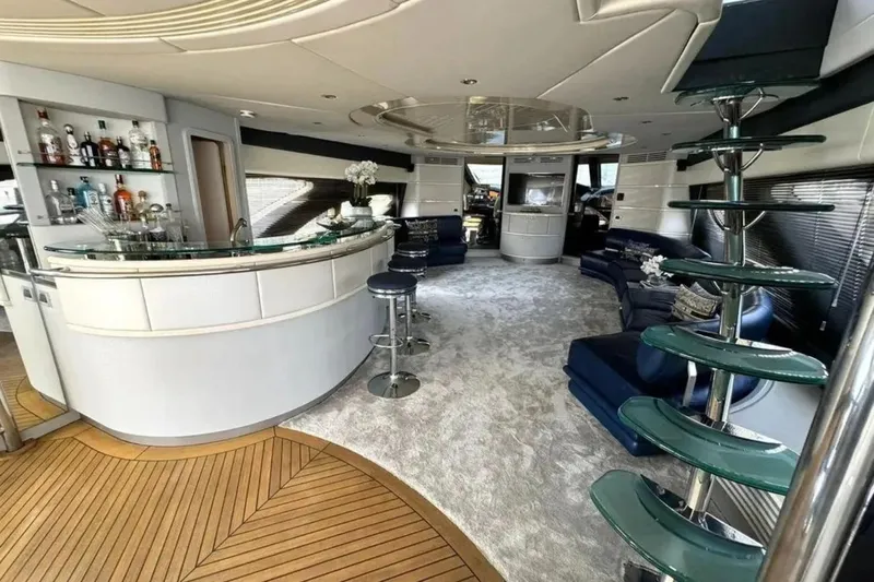  Yacht Photos Pics Luxurious interior of 2003 Azimut 98 Leonardo yacht with bar and modern seating area.