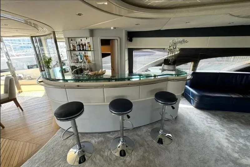  Yacht Photos Pics Luxurious interior of 2003 Azimut 98 Leonardo yacht with elegant bar and seating area.