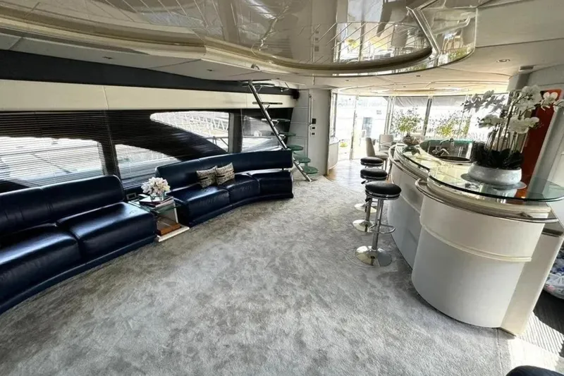  Yacht Photos Pics Luxurious interior of 2003 Azimut 98 Leonardo yacht with sleek seating and modern bar area.