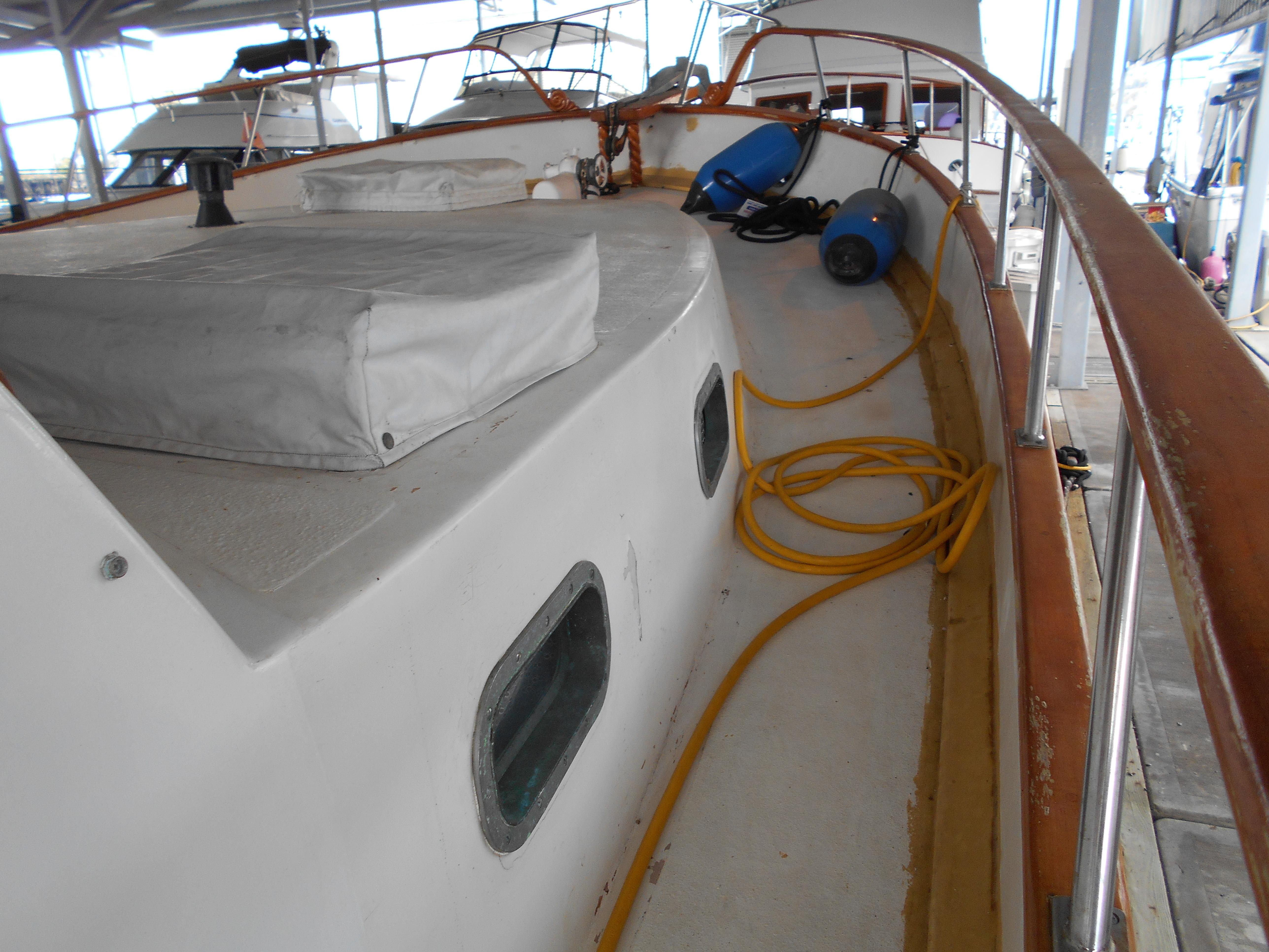 1977 Davis 42' boat deck with equipment and coiled yellow hose.