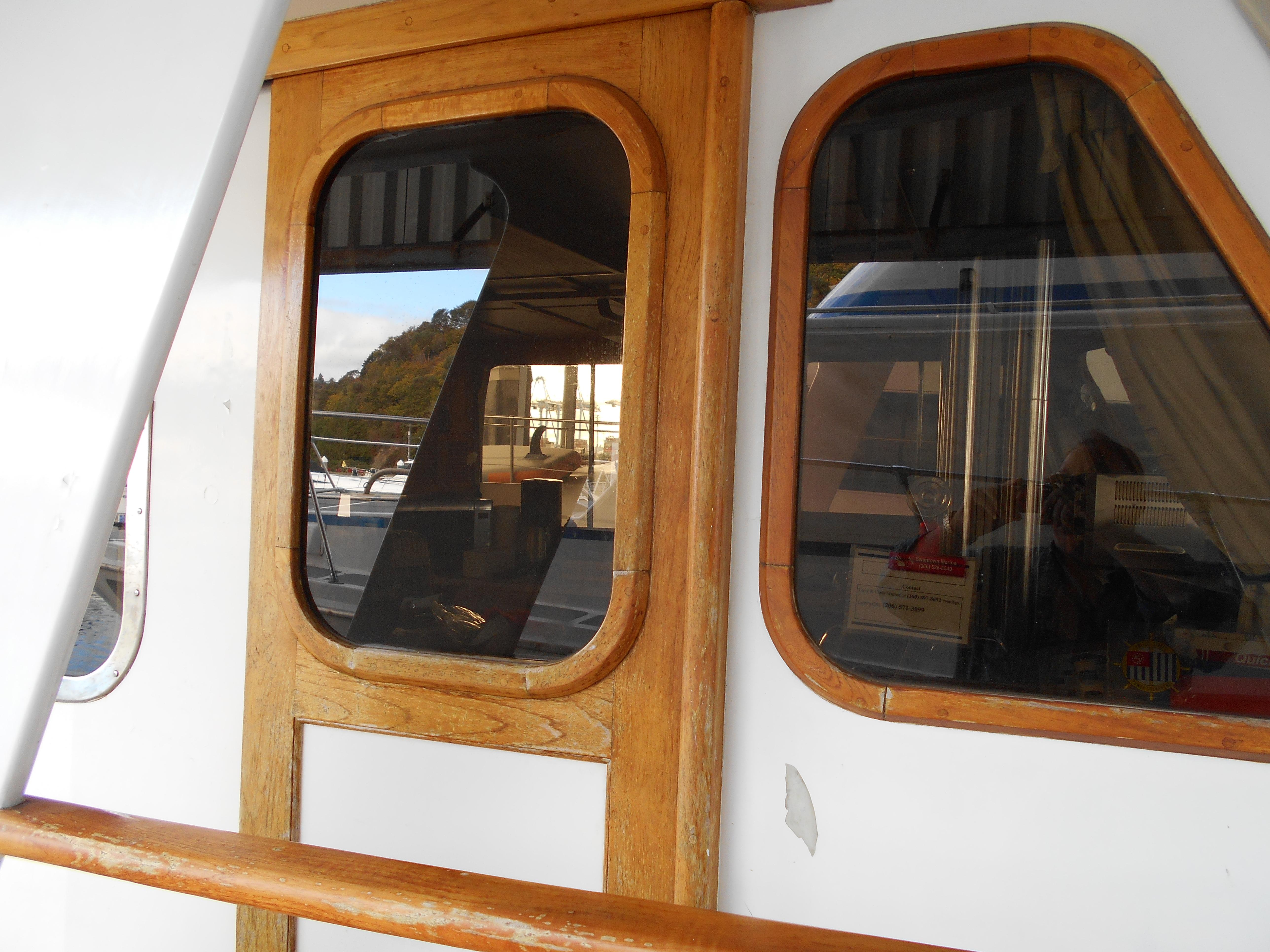 1977 Davis 42' boat with wooden-framed windows and white exterior.