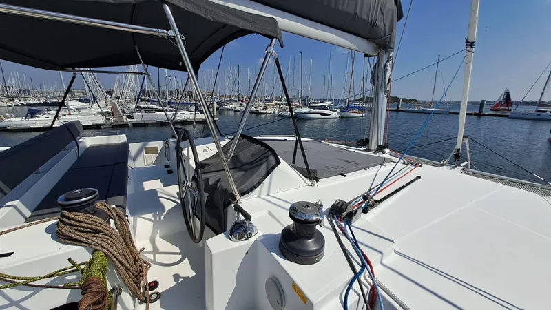  Yacht Photos Pics Lagoon 450 F catamaran deck, 2012 model, docked at marina with clear blue sky.