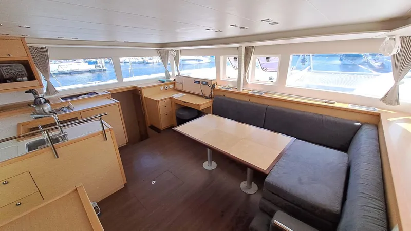  Yacht Photos Pics Spacious interior of 2012 Lagoon 450 F catamaran with modern seating and large windows.