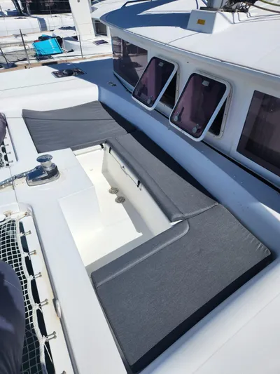  Yacht Photos Pics 2012 Lagoon 450 F catamaran deck with cushioned seating and windows.