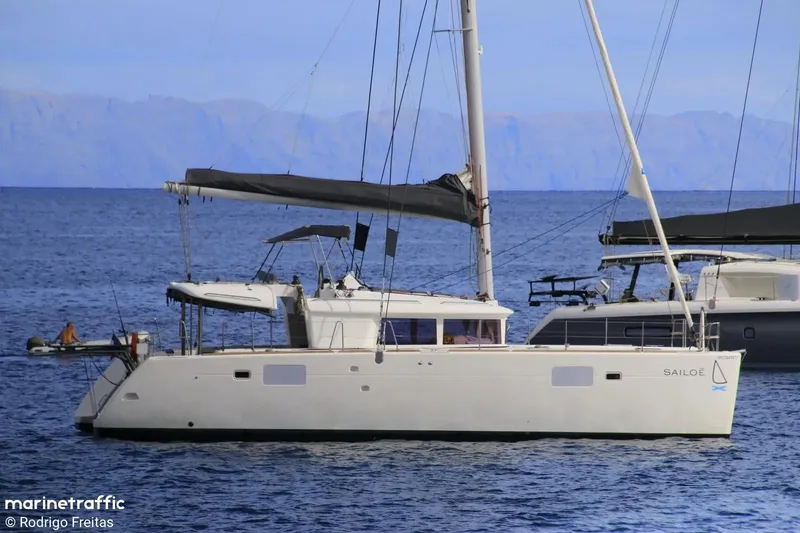  Yacht Photos Pics 2012 Lagoon 450 F catamaran sailing on calm blue waters.