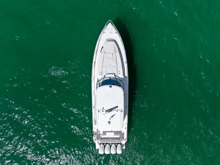  Yacht Photos Pics Aerial view of 2018 Intrepid 475 Sport Yacht on green water.