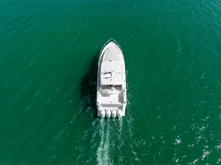  Yacht Photos Pics Aerial view of 2018 Intrepid 475 Sport Yacht cruising on open water.