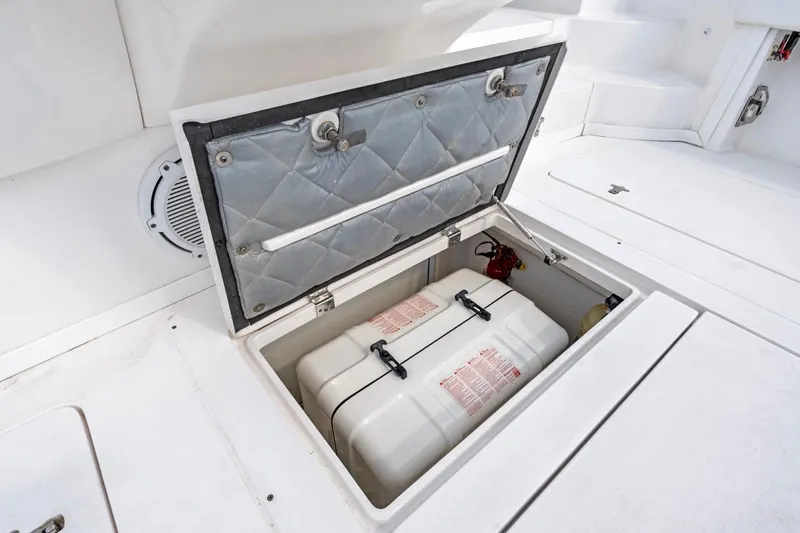  Yacht Photos Pics Open storage compartment on 2018 Intrepid 475 Sport Yacht deck, revealing equipment inside.