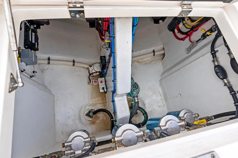  Yacht Photos Pics Engine compartment of 2018 Intrepid 475 Sport Yacht, showcasing wiring and mechanical components.
