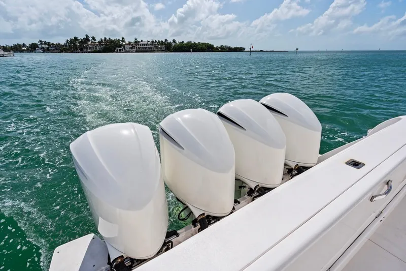  Yacht Photos Pics 2018 Intrepid 475 Sport Yacht with four powerful outboard engines cruising on blue waters.