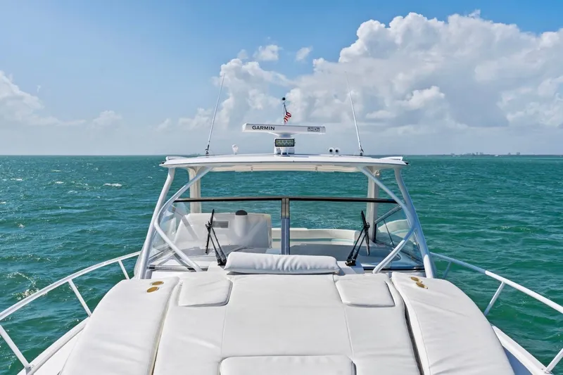  Yacht Photos Pics 2018 Intrepid 475 Sport Yacht cruising on open sea under clear skies.