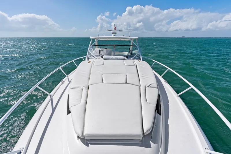  Yacht Photos Pics 2018 Intrepid 475 Sport Yacht cruising on open sea under clear skies.