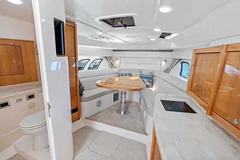  Yacht Photos Pics Luxurious interior of 2018 Intrepid 475 Sport Yacht with modern amenities and elegant design.