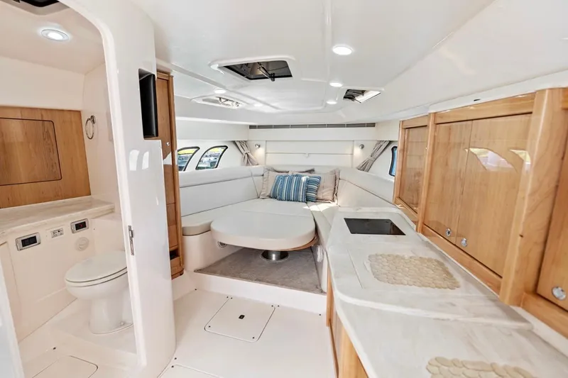  Yacht Photos Pics Luxurious interior of 2018 Intrepid 475 Sport Yacht with modern amenities and elegant design.
