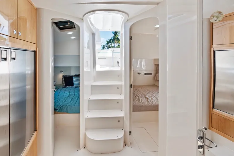  Yacht Photos Pics Interior of 2018 Intrepid 475 Sport Yacht, featuring modern design and comfortable sleeping quarters.