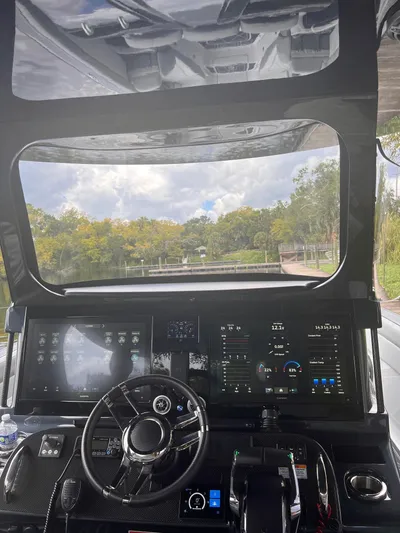  Yacht Photos Pics 2024 Mystic Powerboats M3800 cockpit with advanced navigation displays and steering wheel.