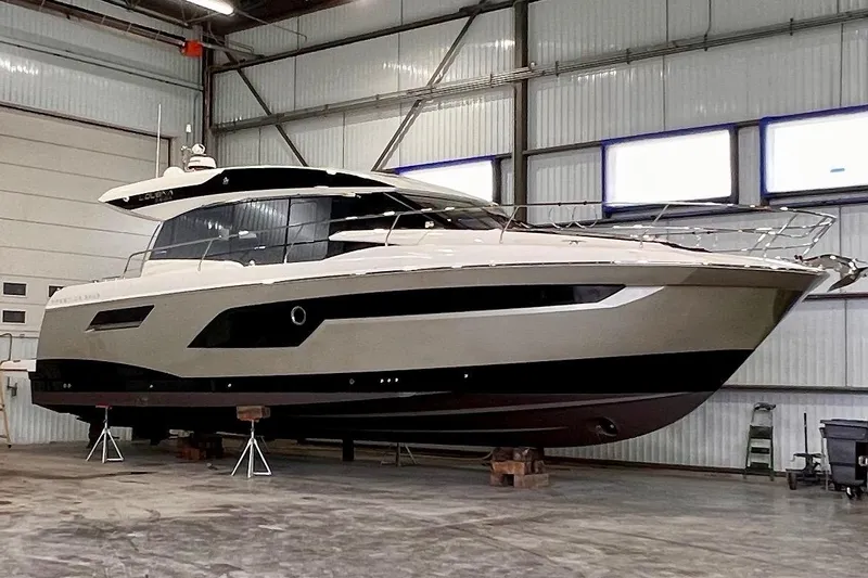  Yacht Photos Pics 2018 Prestige 520 yacht in a warehouse, elevated on supports.