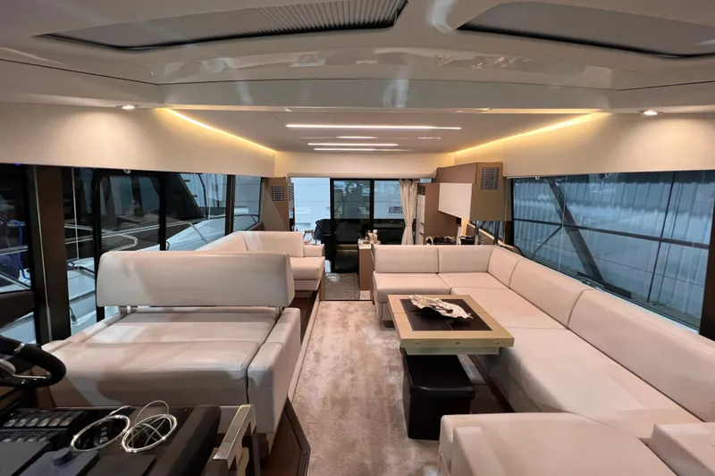  Yacht Photos Pics Luxurious interior of a 2018 Prestige 520 yacht with elegant white seating and modern design.