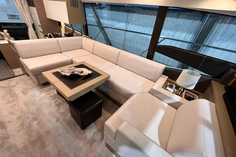  Yacht Photos Pics Luxurious interior of 2018 Prestige 520 yacht with elegant beige seating and modern decor.