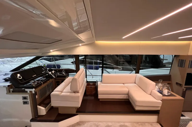 Yacht Photos Pics Luxurious interior of a 2018 Prestige 520 yacht with modern seating and helm station.