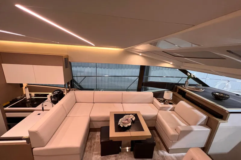  Yacht Photos Pics Luxurious interior of a 2018 Prestige 520 yacht with modern white seating and elegant decor.