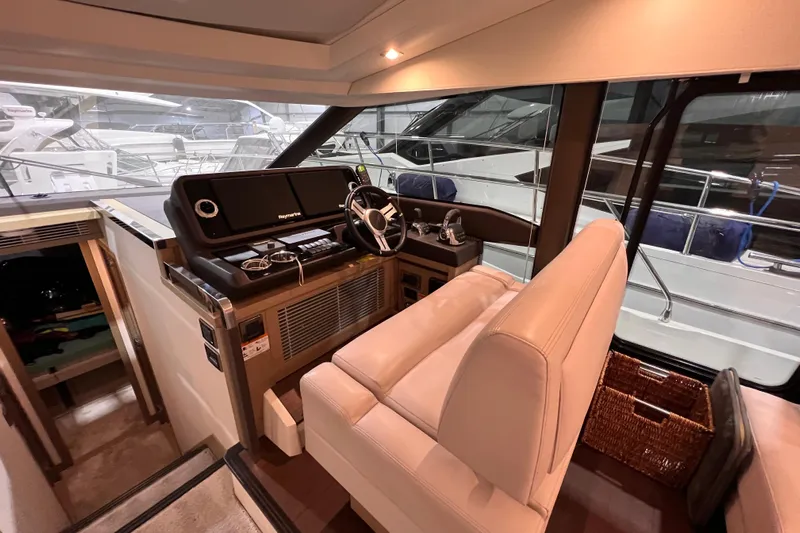  Yacht Photos Pics Luxurious interior of a 2018 Prestige 520 yacht with modern helm and seating.