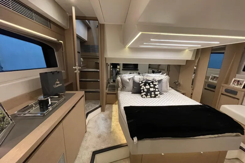  Yacht Photos Pics Luxurious interior of a 2018 Prestige 520 yacht with modern bedroom and elegant decor.