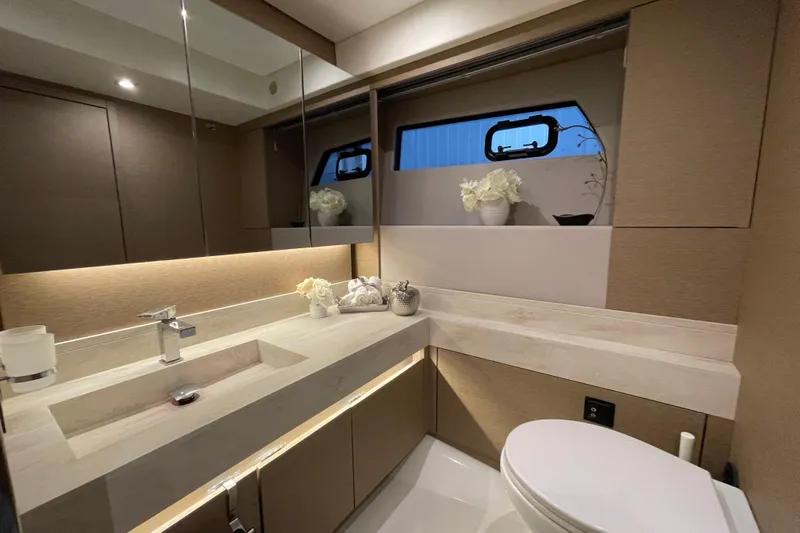  Yacht Photos Pics Luxurious bathroom interior of 2018 Prestige 520 yacht with modern fixtures and elegant decor.