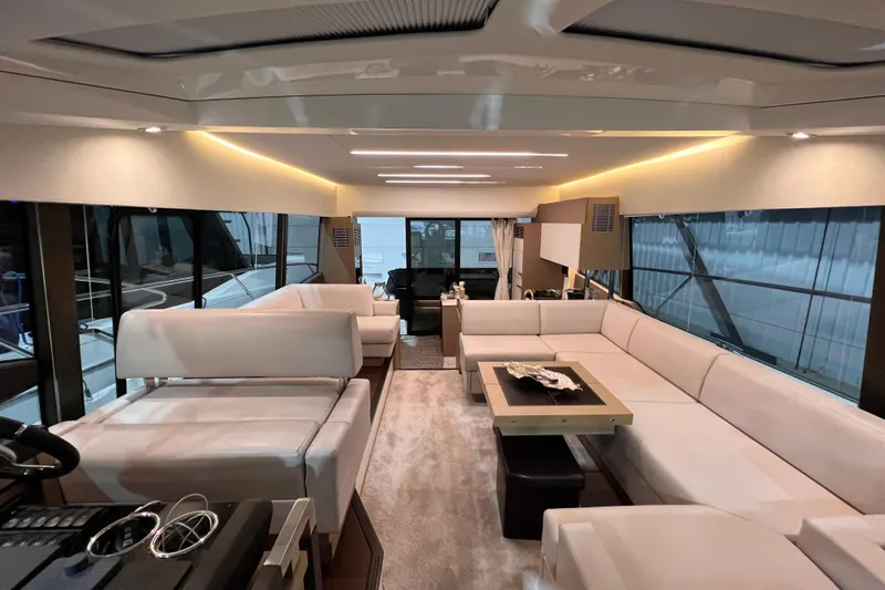  Yacht Photos Pics Luxurious interior of a 2018 Prestige 520 yacht with elegant white seating and modern design.