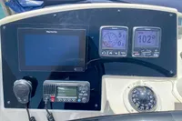 Control panel of a 2013 Nautitech 542 catamaran with navigation instruments and communication devices.