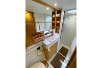 Luxurious bathroom in 2013 Nautitech 542 yacht with modern fixtures and ample storage.