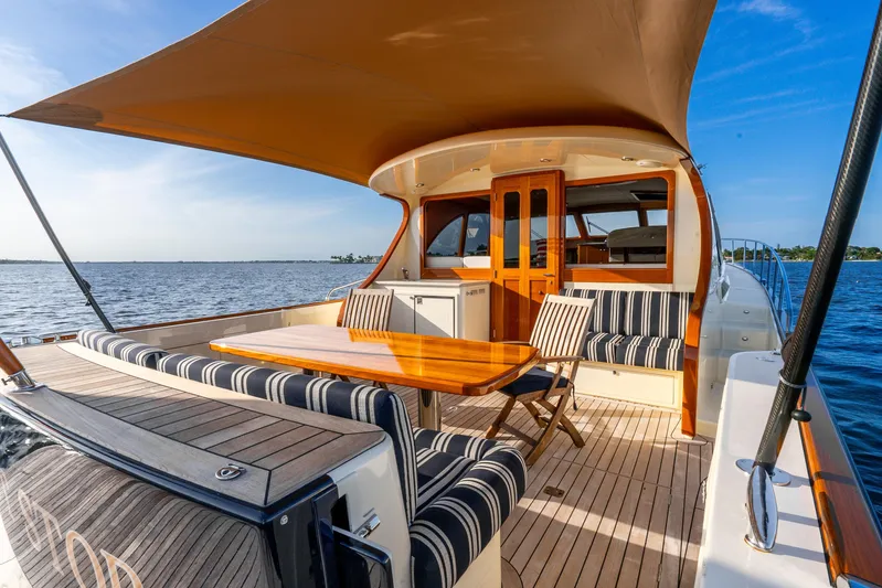 Pitt Stop Yacht Photos Pics 2020 Palm Beach Motor Yachts PB55 with elegant deck seating and ocean view.
