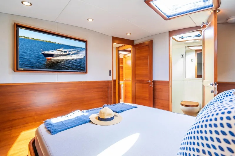 Pitt Stop Yacht Photos Pics Luxurious 2020 Palm Beach Motor Yachts PB55 cabin interior with elegant wood finishes.