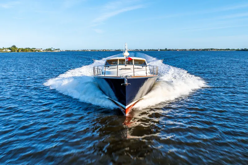 Pitt Stop Yacht Photos Pics 2020 Palm Beach Motor Yachts PB55 cruising on open water, showcasing sleek design and performance.