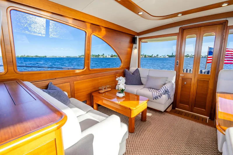 Pitt Stop Yacht Photos Pics Luxurious interior of 2020 Palm Beach Motor Yachts PB55 with ocean view and elegant wood finish.