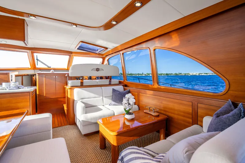 Pitt Stop Yacht Photos Pics Luxurious interior of 2020 Palm Beach Motor Yachts PB55 with elegant wood finish and ocean view.