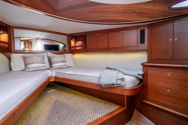 Pitt Stop Yacht Photos Pics Luxurious interior cabin of 2020 Palm Beach Motor Yachts PB55, featuring elegant wood finishes.