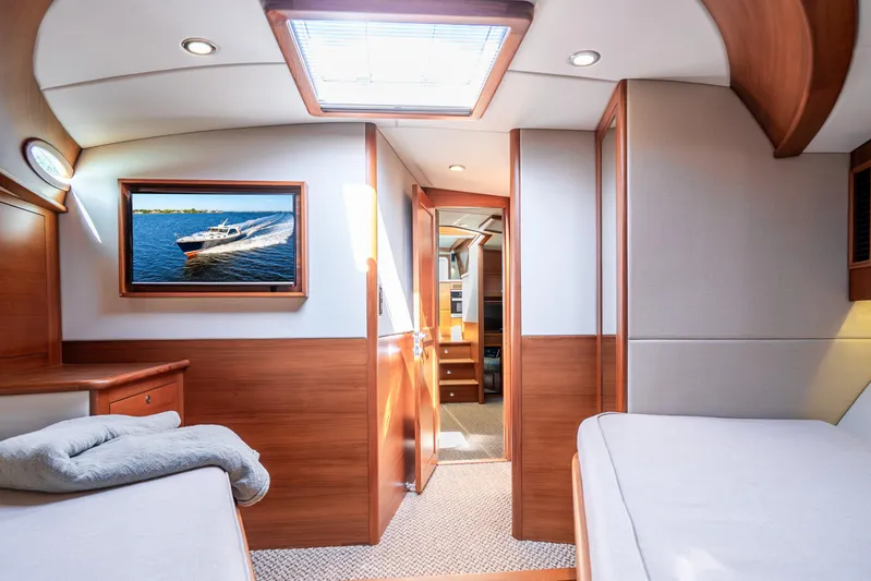 Pitt Stop Yacht Photos Pics Luxurious 2020 Palm Beach Motor Yachts PB55 cabin interior with elegant wood finishes.