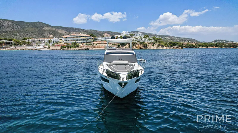  Yacht Photos Pics Front view of 2021 Galeon 680 Fly yacht on calm blue water.