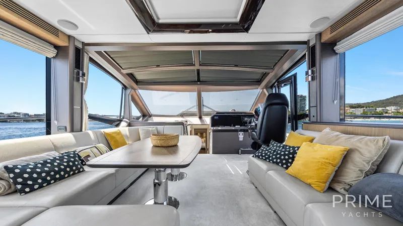  Yacht Photos Pics Luxurious interior of 2021 Galeon 680 Fly yacht with elegant seating and panoramic views.