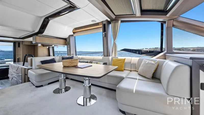 Yacht Photos Pics Luxurious interior of 2021 Galeon 680 Fly yacht with ocean view and elegant seating.