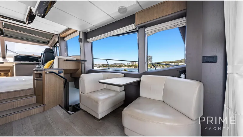  Yacht Photos Pics Luxurious interior of 2021 Galeon 680 Fly yacht with modern seating and scenic views.