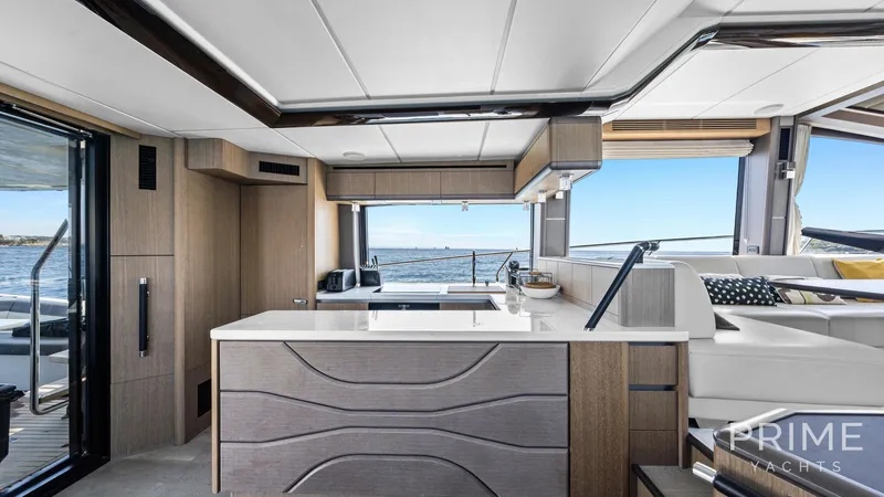  Yacht Photos Pics Luxurious interior of 2021 Galeon 680 Fly yacht with modern kitchen and ocean view.